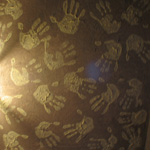 Hands working with building material